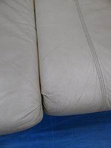 Two Cream Leather Sofas & Armchair
