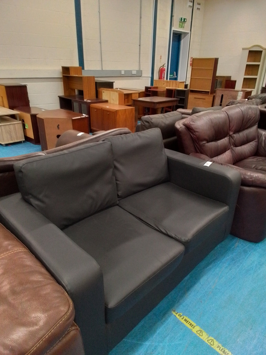 Black Leather Look Two Seater Sofa